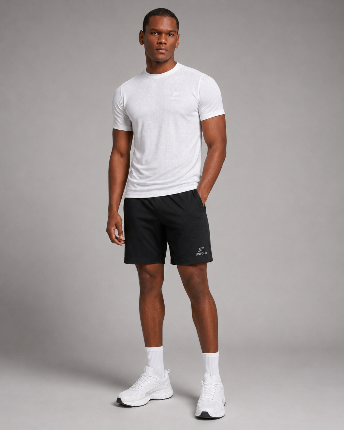 a fit man wearing t-shirt white with short black plus the shoes